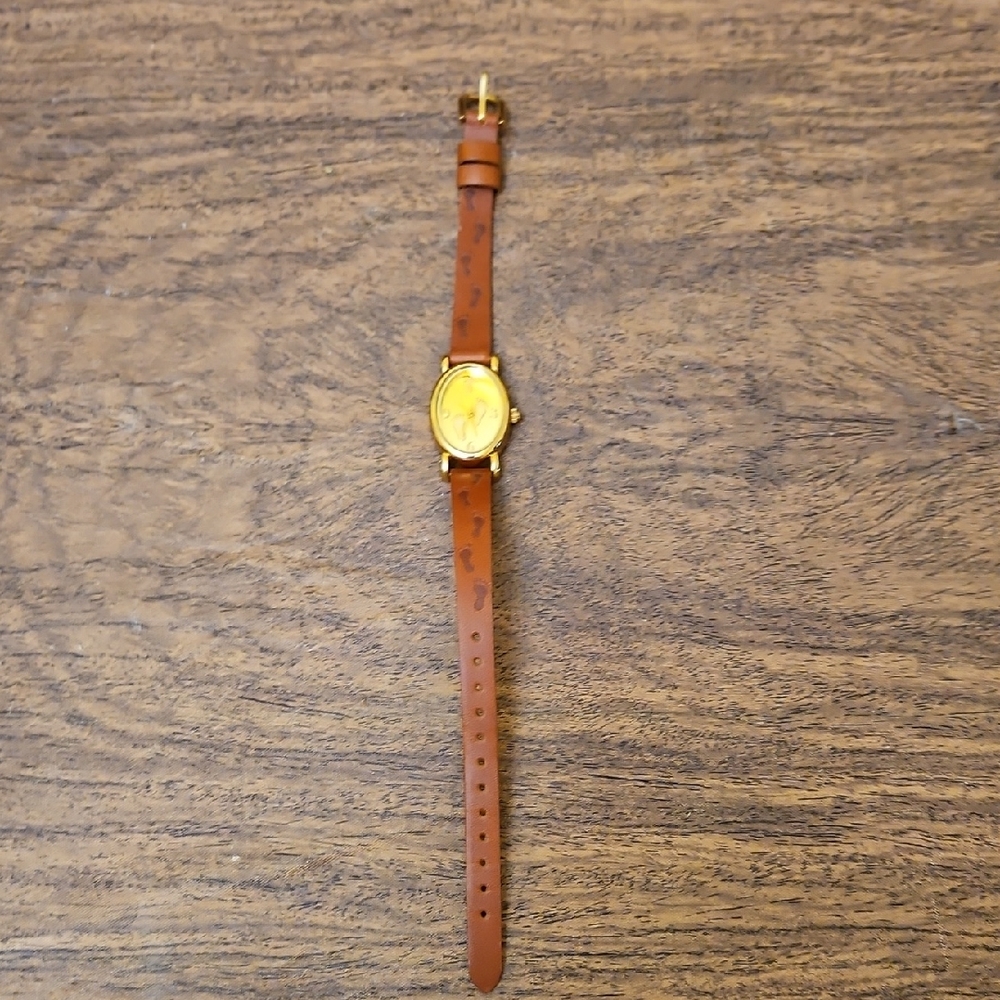 Avon vintage Women's Quartz wristwatch Footprints Inscribed Brown Leather Band